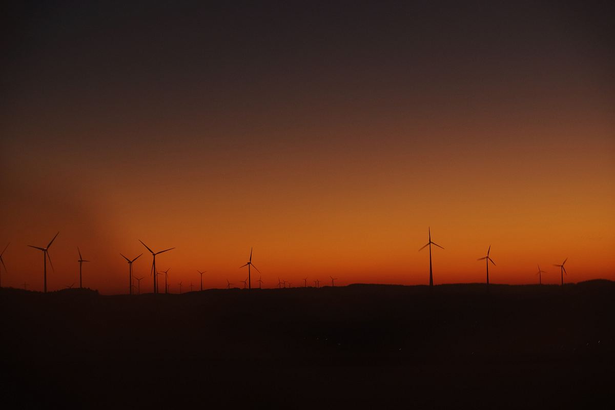 silhouette photography of wind mills